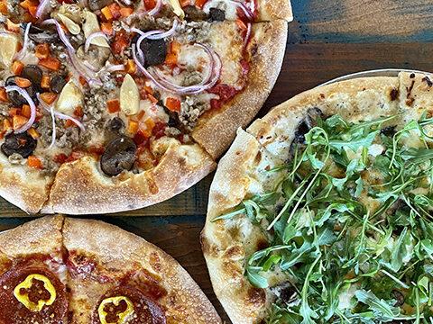 Photo of three different pizzas from Park Pizza & Brewing Co. located in Lake Nona.