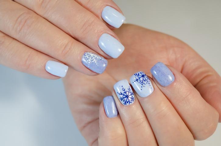 Winter nail design with snow flakes.